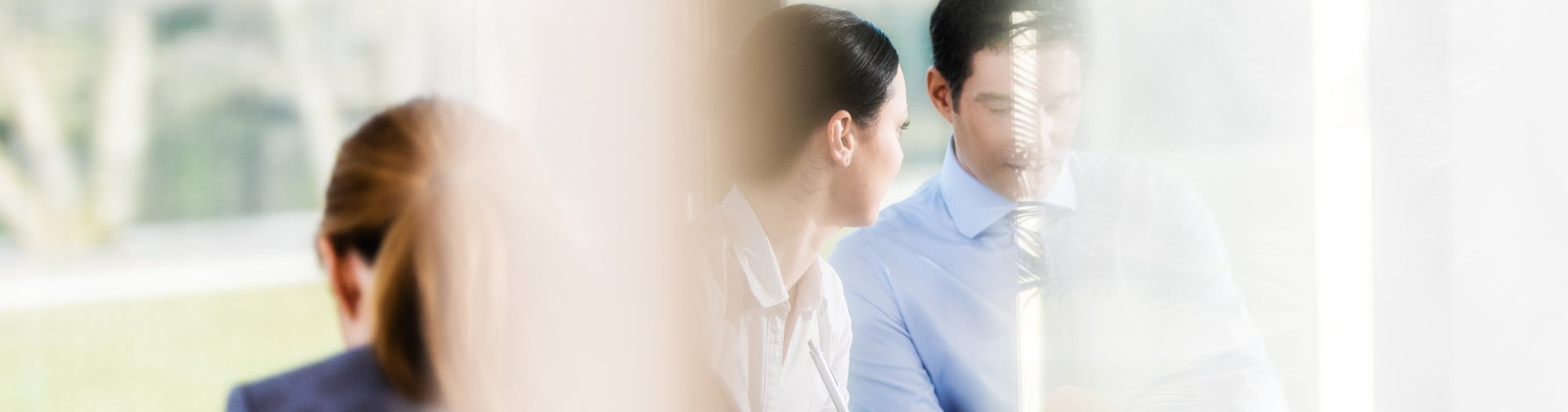 Man and woman talking in a meeting