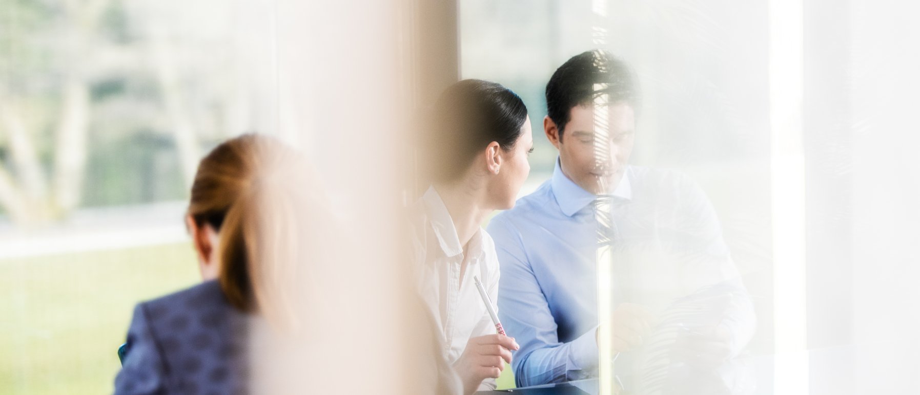 Man and woman talking in a meeting